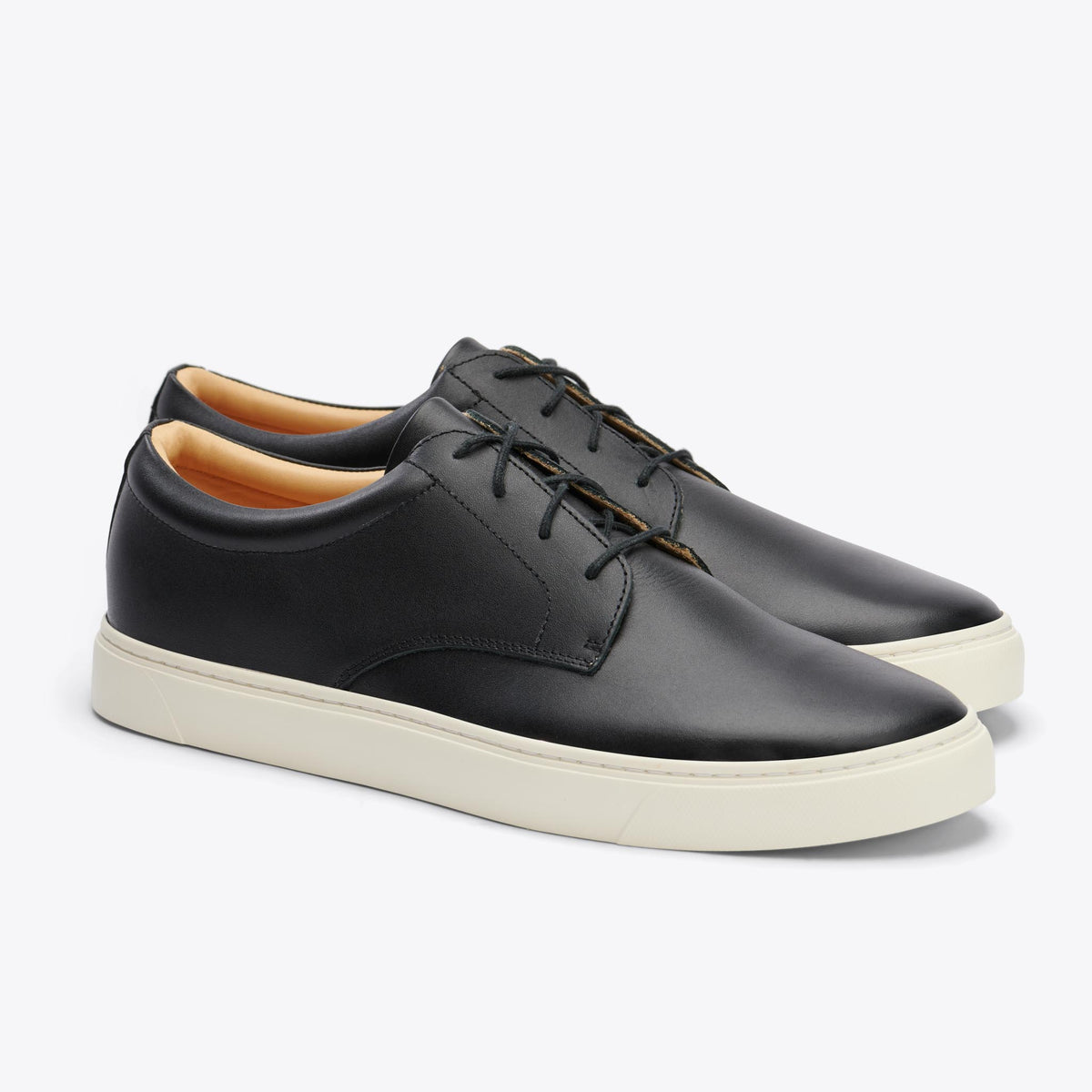 Pair of black leather Diego Everyday Sneakers with white rubber soles and black laces on a white background.