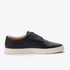 Single black leather sneaker with matching laces and a white rubber sole, shown from a side profile view.
