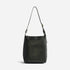Black leather shoulder bag with a long strap and NISOLO embossed at the base.