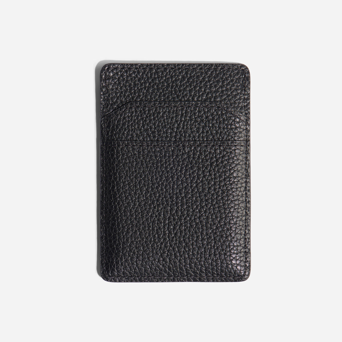 Black pebbled leather Nico Card Case Wallet with two card slots and stitched edges on a white background.