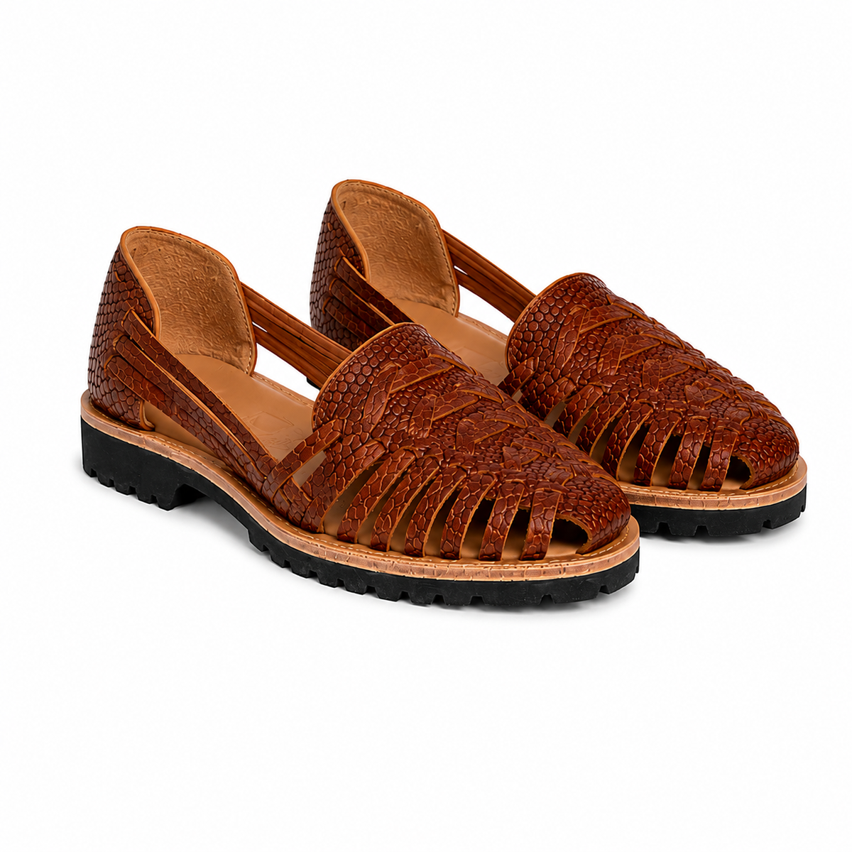 Pair of brown woven leather huarache sandals with snake-print texture and black lug soles on a white background.