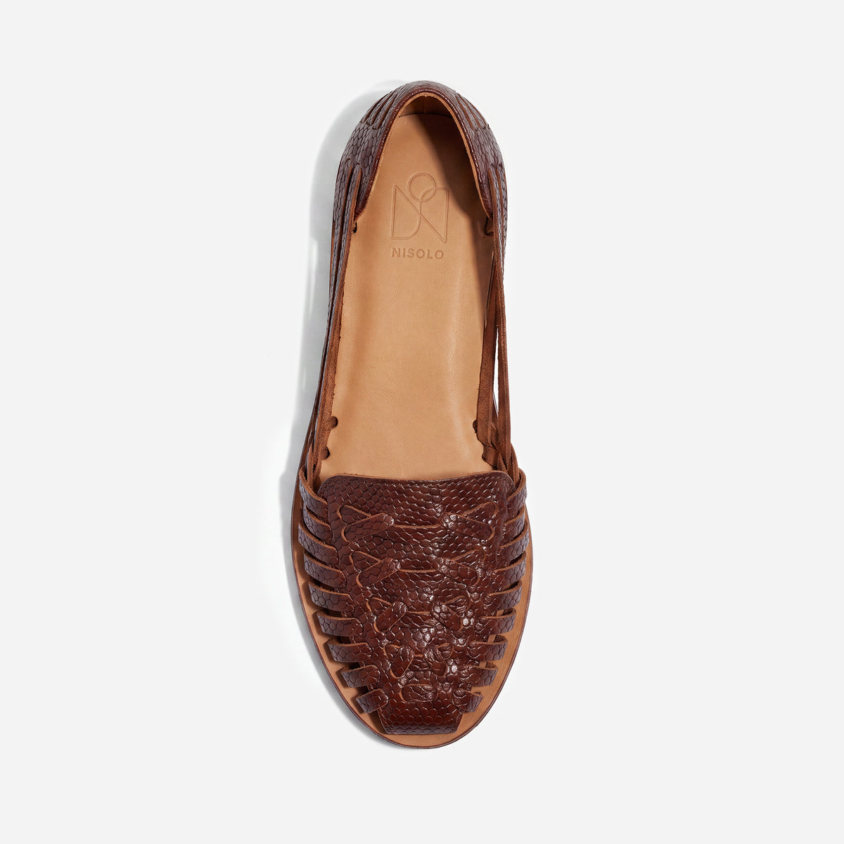Single brown snake-textured leather huarache sandal with woven straps and NISOLO printed on the tan footbed.