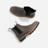 Two grey leather Chelsea boots with black elastic side panels and lugged soles, shown from top and side angles.