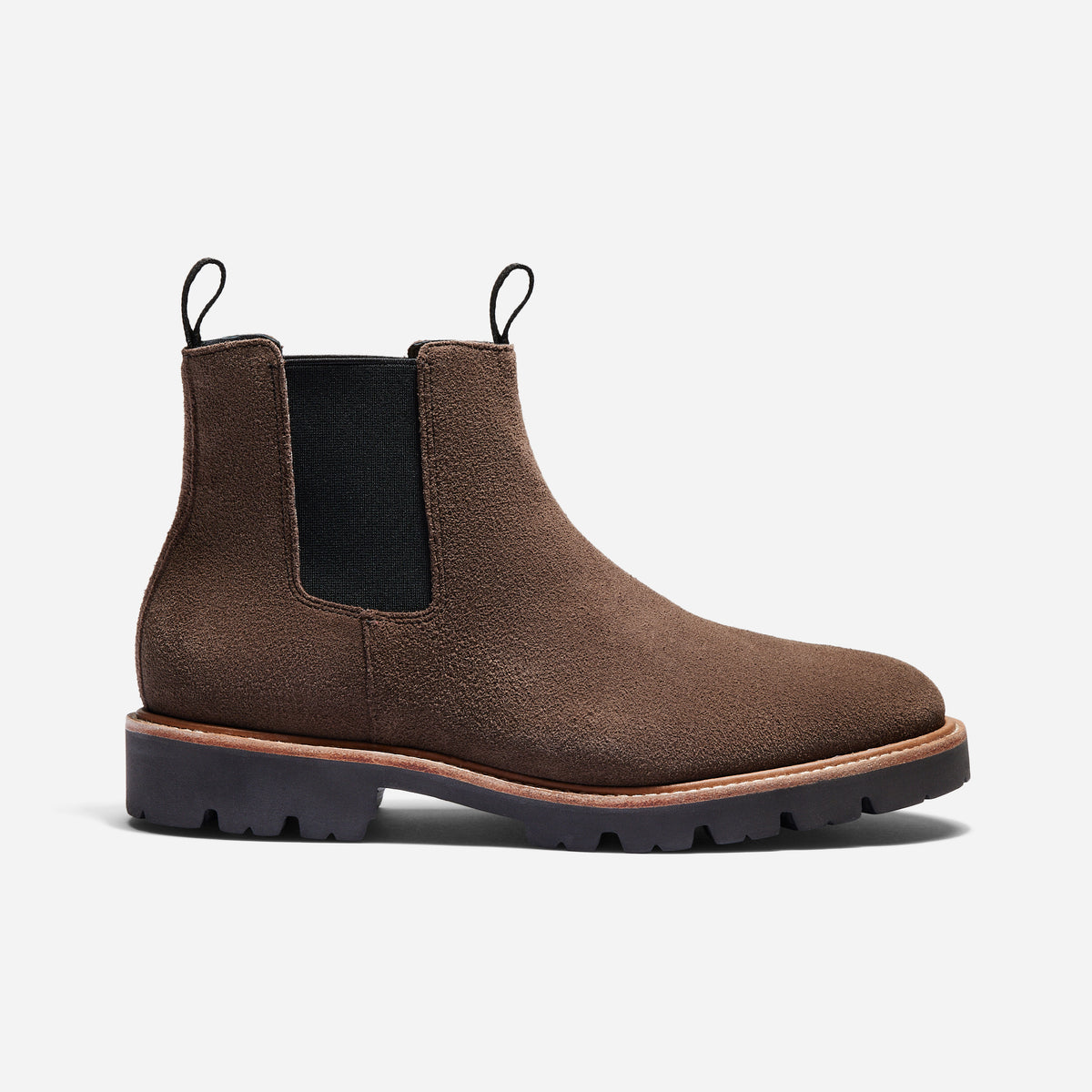 Single umber brown suede Chelsea boot with black elastic side panels and a thick lugged sole.