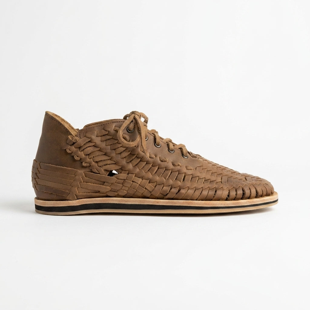 Single brown woven leather Huarache Boot with laces and a flat sole shown from a side profile on a white background.