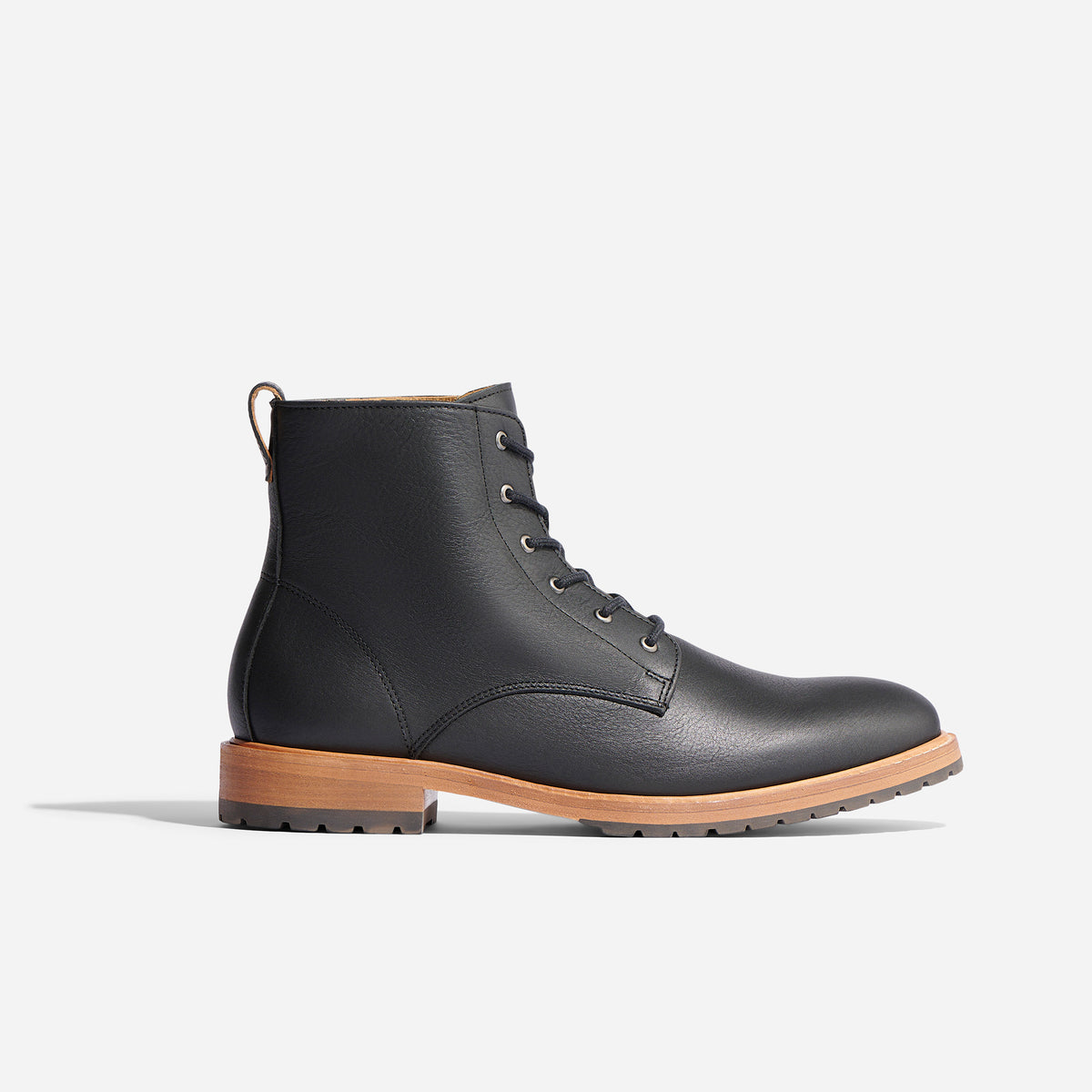 Single black leather lace-up boot with a tan wood-look midsole and lugged rubber outsole shown in profile.