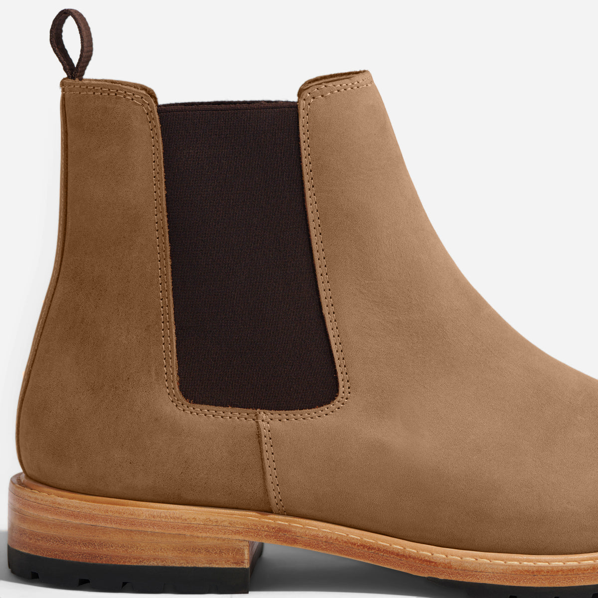 Single tobacco brown leather Chelsea boot with a dark brown elastic side panel and a pull tab.