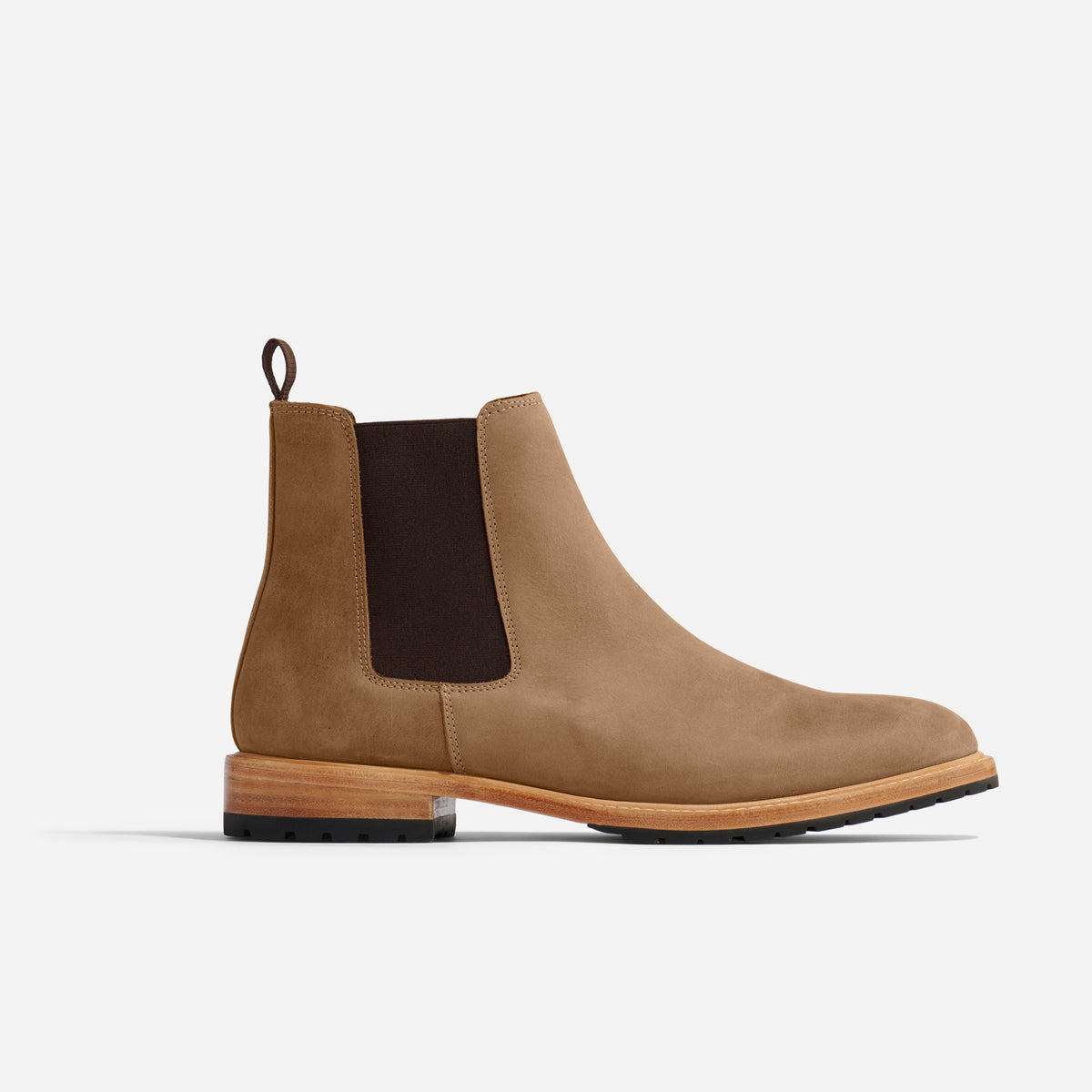 Single tobacco brown leather Chelsea boot with a dark elastic side panel and a light wood-colored sole.