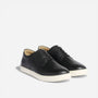 Pair of black leather Diego Everyday Sneakers with white soles and black laces on a white background.