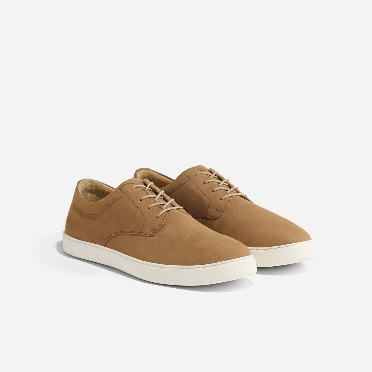 Pair of tobacco brown leather Diego Everyday Sneakers with tan laces and white rubber soles on a white background.