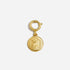 Single gold metal round shoe charm with an embossed logo hanging from a circular clasp.