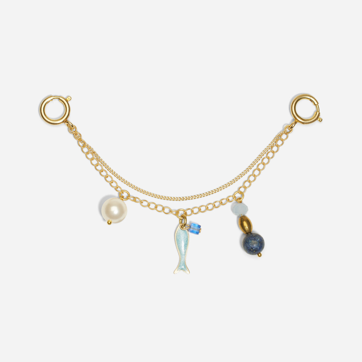 Gold metal double chain shoe charm with a white pearl, blue fish, and round beads hanging from two circular clasps.