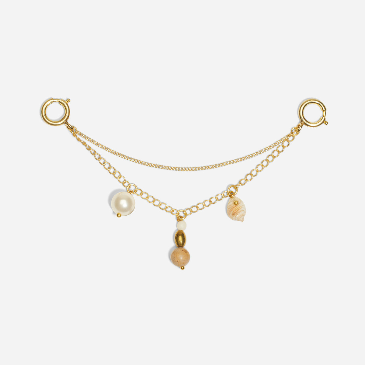 Double-strand gold metal shoe charm chain with a white pearl, seashell, and stone beads hanging from the lower link.