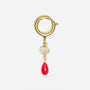 Gold metal ring shoe charm with a clear faceted bead and a red teardrop pendant.