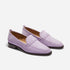 Pair of lilac suede loafers with whipstitch detailing and dark brown soles on a white background.
