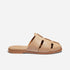 Single almond leather fisherman mule with a woven caged toe and flat sole, shown in profile on a white background.