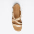 Single tan leather strappy sandal with a buckle heel strap and NISOLO printed on the footbed.