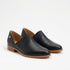 Pair of black leather slip-on oxford shoes with pleated fabric details and tan wood-tone soles on a white background.