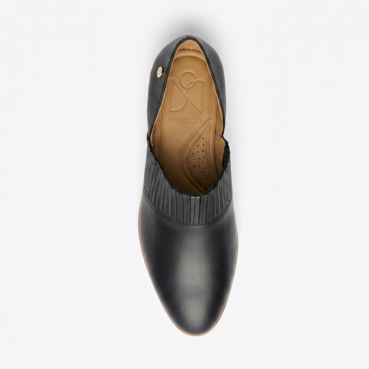 Single black leather slip-on oxford shoe with a tan interior and NISOLO printed on the footbed.