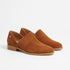 Pair of terracotta suede slip-on oxford shoes with ribbed elastic side panels and low wooden heels.
