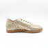Single gold woven leather huarache bootie with laces and a flat brown sole shown from a side profile on a white background.