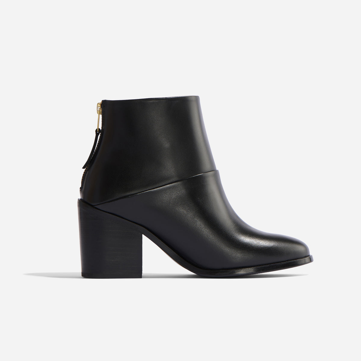 Single black leather ankle boot with a block heel and gold-tone back zipper shown in profile on a white background.