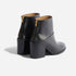 Pair of black leather ankle boots with block heels and gold-tone back zippers on a white background.