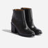 Pair of black leather ankle boots with a block heel and round toe, shown from a side angle on a white background.