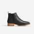 Single black leather Chelsea boot with elastic side panel and light brown sole, shown in profile on a white background.