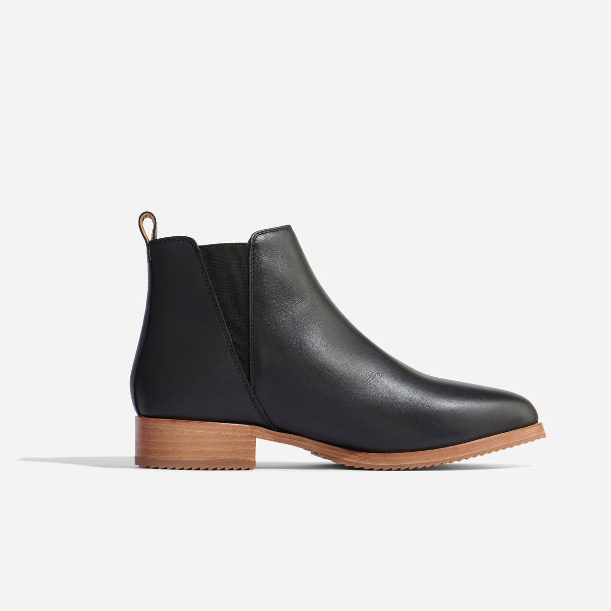 Single black leather Chelsea boot with elastic side panel and light brown sole, shown in profile on a white background.