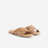 Pair of tan leather Catalina Slide Sandals with wide crisscross straps and flat soles on a white background.