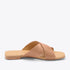 Single tan leather Catalina Slide Sandal with two wide crisscross straps and NISOLO printed on the heel.
