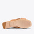 One tan leather slide sandal shown from the bottom, featuring a square toe and the NISOLO brand name on the sole.